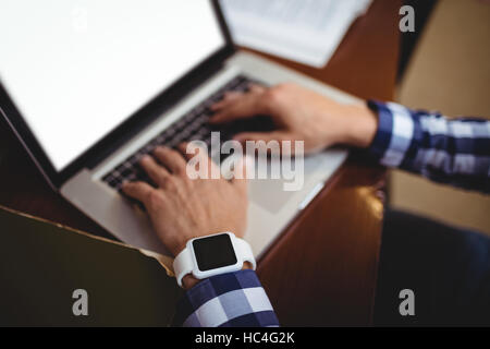 Student using laptop in library Stock Photo
