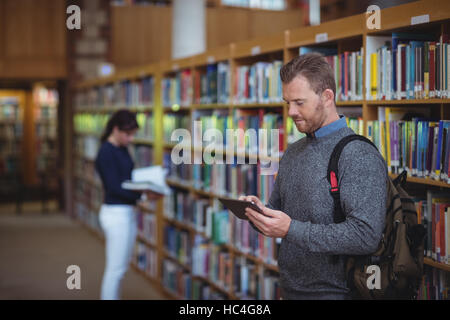 Mature student using digital tablet Stock Photo