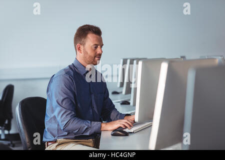 Mature student using computer Stock Photo