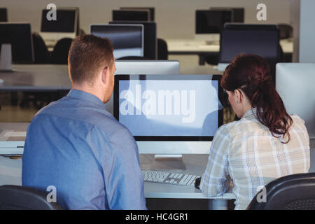 Mature students using computer Stock Photo