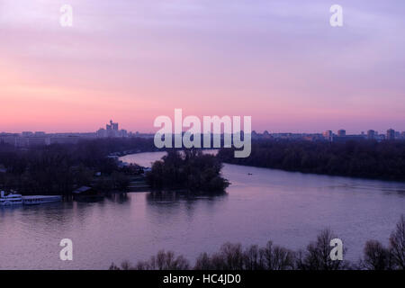 View at sunset from Kalemegdan fortress toward New Belgrade across the confluence of the Sava river into the Danube in the city of Belgrade capital of the Republic of Serbia Stock Photo