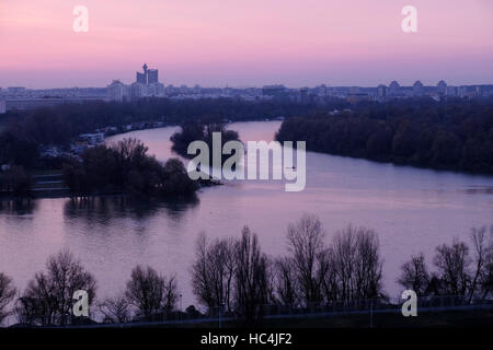 View at sunset toward New Belgrade across the confluence of the Sava river into the Danube in the city of Belgrade capital of the Republic of Serbia Stock Photo