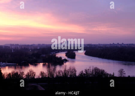 View at sunset from Kalemegdan fortress toward New Belgrade across the confluence of the Sava river into the Danube in the city of Belgrade capital of the Republic of Serbia Stock Photo