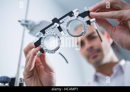 Close-up of optometrist holding messbrille Stock Photo