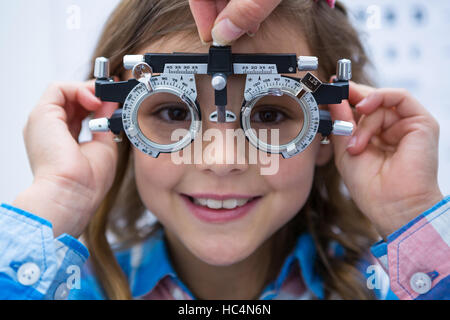 Young girl wearing trial fame Stock Photo