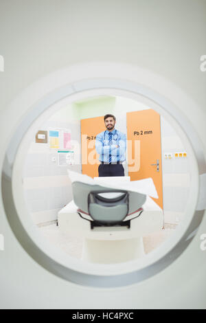 Portrait of doctor standing near mri scanner Stock Photo