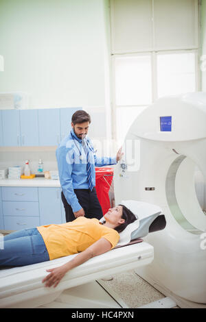 A patient is loaded into an mri machine Stock Photo