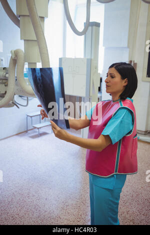 Female doctor examining x-ray Stock Photo