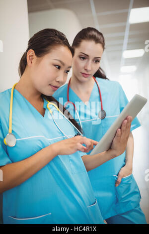 Nurses using digital tablet Stock Photo
