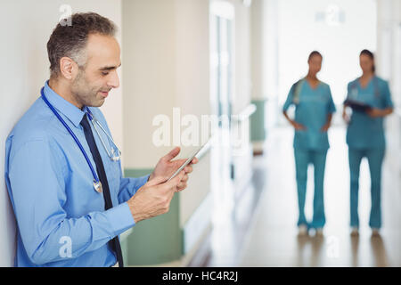Doctor using digital tablet Stock Photo