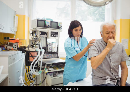 Female doctor examining a patient Stock Photo