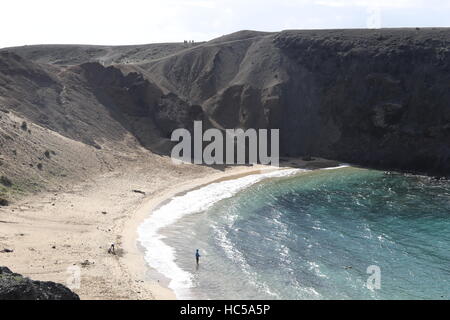 Sea anglers fishing from Papagayo beach on Lanzarote. Stock Photo