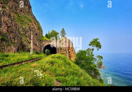 Baikal landscape. Short browsing railway tunnel on lake. Irkutsk region. Russia Stock Photo