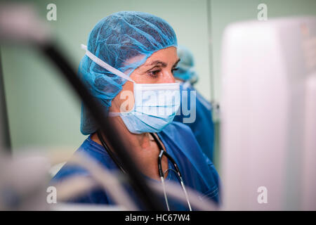 Surgeon using monitor Stock Photo