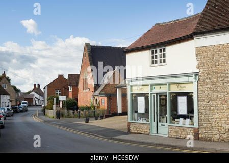 Street scene in the village of Harbury, showing the library and nail & beauty salon, Warwickshire, England, UK Stock Photo