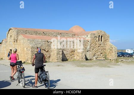 Cyclists, San Giovanni di Sinis church, Sinis, Cabras, Oristano District, Sardinia, Italy, Europe Stock Photo