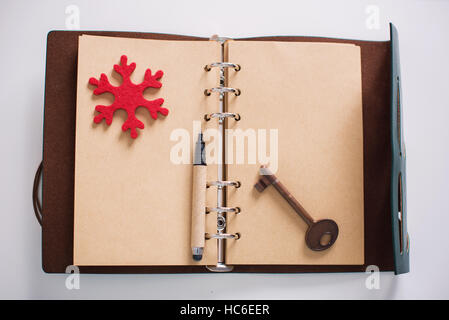 Vintage Notebook of leather cover with antique key Stock Photo
