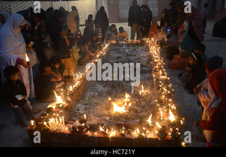 Lahore, Pakistan. 07th Dec, 2016. Pakistani Muslim devotees gathered to attend the 393rd death anniversary of the saint Mir Mohammed Muayyinul Islam popularly known as Sain Mian Mir. The saint was equally popular among the Muslim and Sikh religions, as Mian Mir went to Amritsar in December 1588 to lay the foundation stone of Sikhs holiest site, the Golden Temple, which is commonly known as Sri Harminder Sahib. Credit:  Rana Sajid Hussain/Pacific Press/Alamy Live News Stock Photo