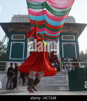 Lahore, Pakistan. 07th Dec, 2016. Pakistani Muslim devotees gathered to attend the 393rd death anniversary of the saint Mir Mohammed Muayyinul Islam popularly known as Sain Mian Mir. The saint was equally popular among the Muslim and Sikh religions, as Mian Mir went to Amritsar in December 1588 to lay the foundation stone of Sikhs holiest site, the Golden Temple, which is commonly known as Sri Harminder Sahib. Credit:  Rana Sajid Hussain/Pacific Press/Alamy Live News Stock Photo