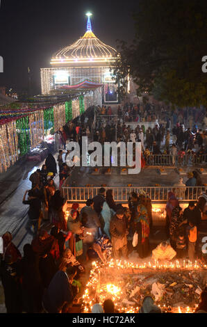 Lahore, Pakistan. 07th Dec, 2016. Pakistani Muslim devotees gathered to attend the 393rd death anniversary of the saint Mir Mohammed Muayyinul Islam popularly known as Sain Mian Mir. The saint was equally popular among the Muslim and Sikh religions, as Mian Mir went to Amritsar in December 1588 to lay the foundation stone of Sikhs holiest site, the Golden Temple, which is commonly known as Sri Harminder Sahib. Credit:  Rana Sajid Hussain/Pacific Press/Alamy Live News Stock Photo