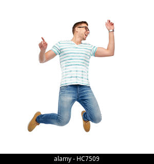 happy young man jumping in air Stock Photo