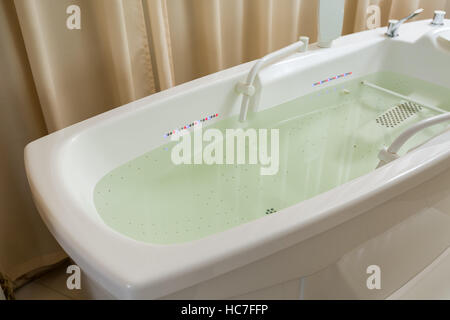 Empty jacuzzi, tub filled with water in the spa Stock Photo