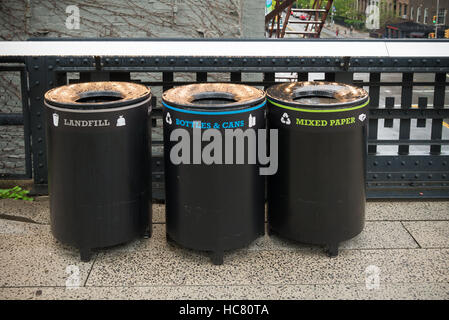 three trash bins for different types of garbage in the streets of new york Stock Photo