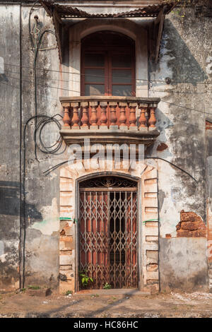 House or houses built in the old colonial Portuguese style, Panjim, Goa, India, now abandoned and derelict. Stock Photo