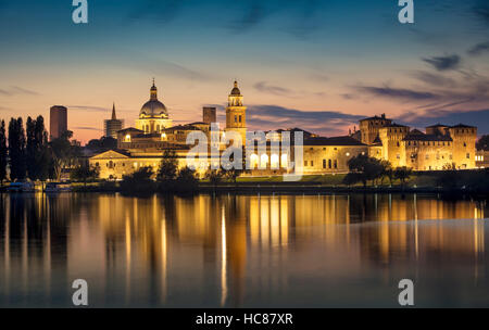 Twilight over Mantova skyline reflected in Lago Inferiore, Lombardy, Italy Stock Photo