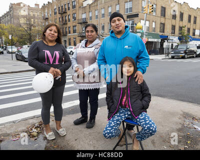 Three generations of Mexican family at First Annual Day of the Dead Celebration in the Kensington section of Brooklyn, New York on October 30, 2016. Stock Photo