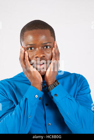Handsome black man in bow tie, looking at the camera with   surprise Stock Photo