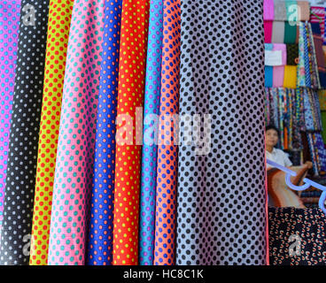 Polka dot fabrics for sale in a local market Stock Photo