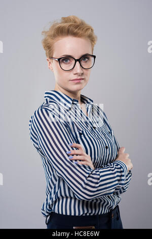 Serious face of young businesswoman Stock Photo