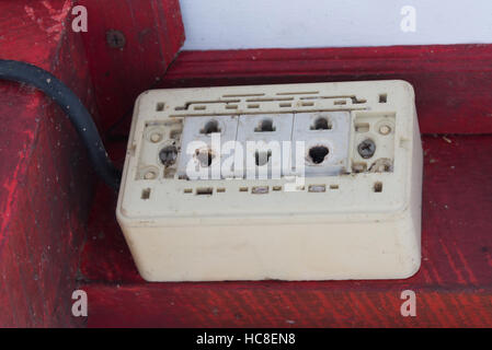 Close-up of old socket, electrical outlet on ceiling. Stock Photo