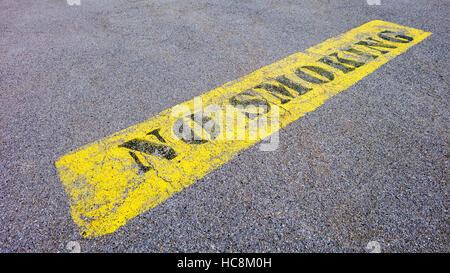 No smoking sign painted on asphalt Stock Photo