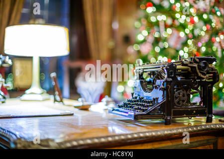 Retro Christmas interior with old typewriter Stock Photo