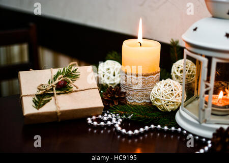 Christmas decoration on wooden table in cafe. Stock Photo