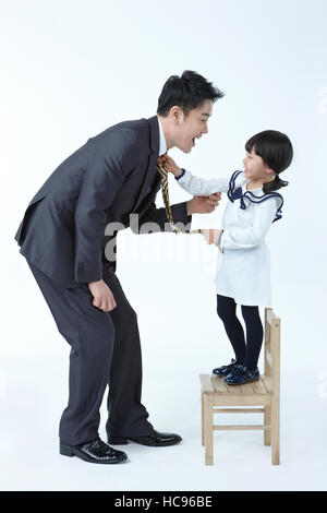 Side view of smiling businessman and his daughter Stock Photo