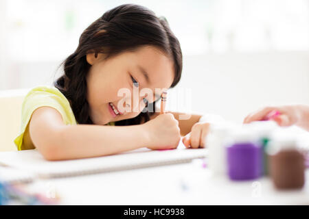 Portrait of girl drawing picture Stock Photo