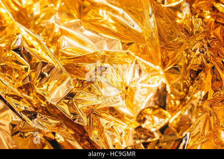 Shiny yellow leaf gold foil texture background Stock Photo