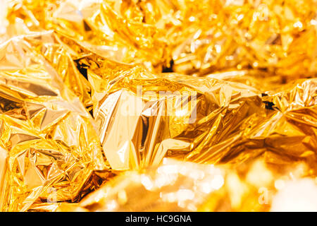 Shiny yellow leaf gold foil texture background Stock Photo