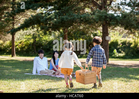 Harmonious family having picnic Stock Photo