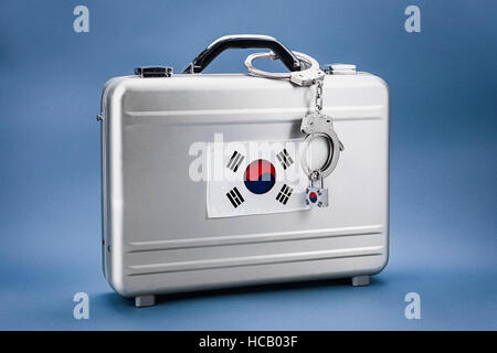 Briefcase with handcuffs and Korean flag Stock Photo