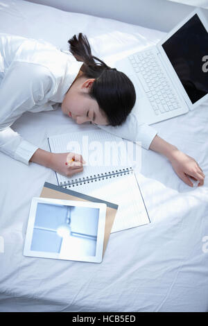 Tired middle school girl sleeping Stock Photo