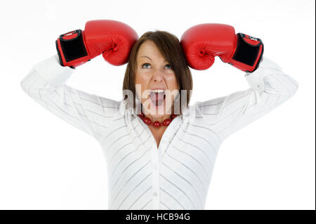 Young business woman with boxing gloves Stock Photo