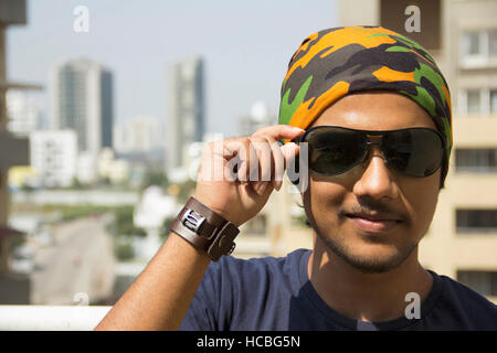 Close-up of  young Indian boy wearing sun glasses Stock Photo