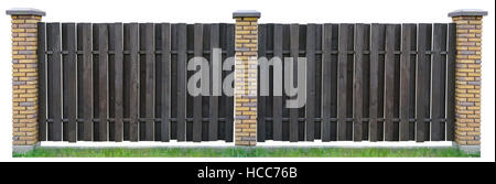 Fence from brown wooden boards. Columns from uneven beaten yellow bricks. The basis is made of concrete.  Isolated on white collage Stock Photo
