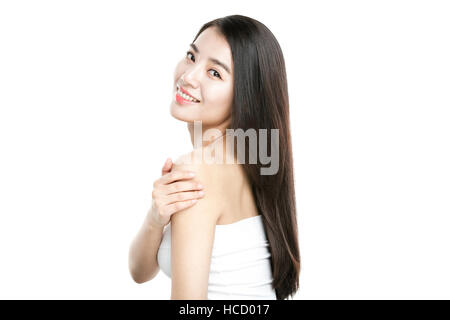 Side view of young smiling woman with long straight hair Stock Photo