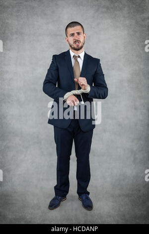 businessman with bound hands Stock Photo
