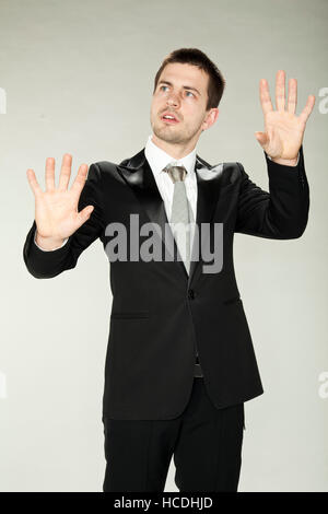 businessman in formal wear touching empty virtual glass Stock Photo